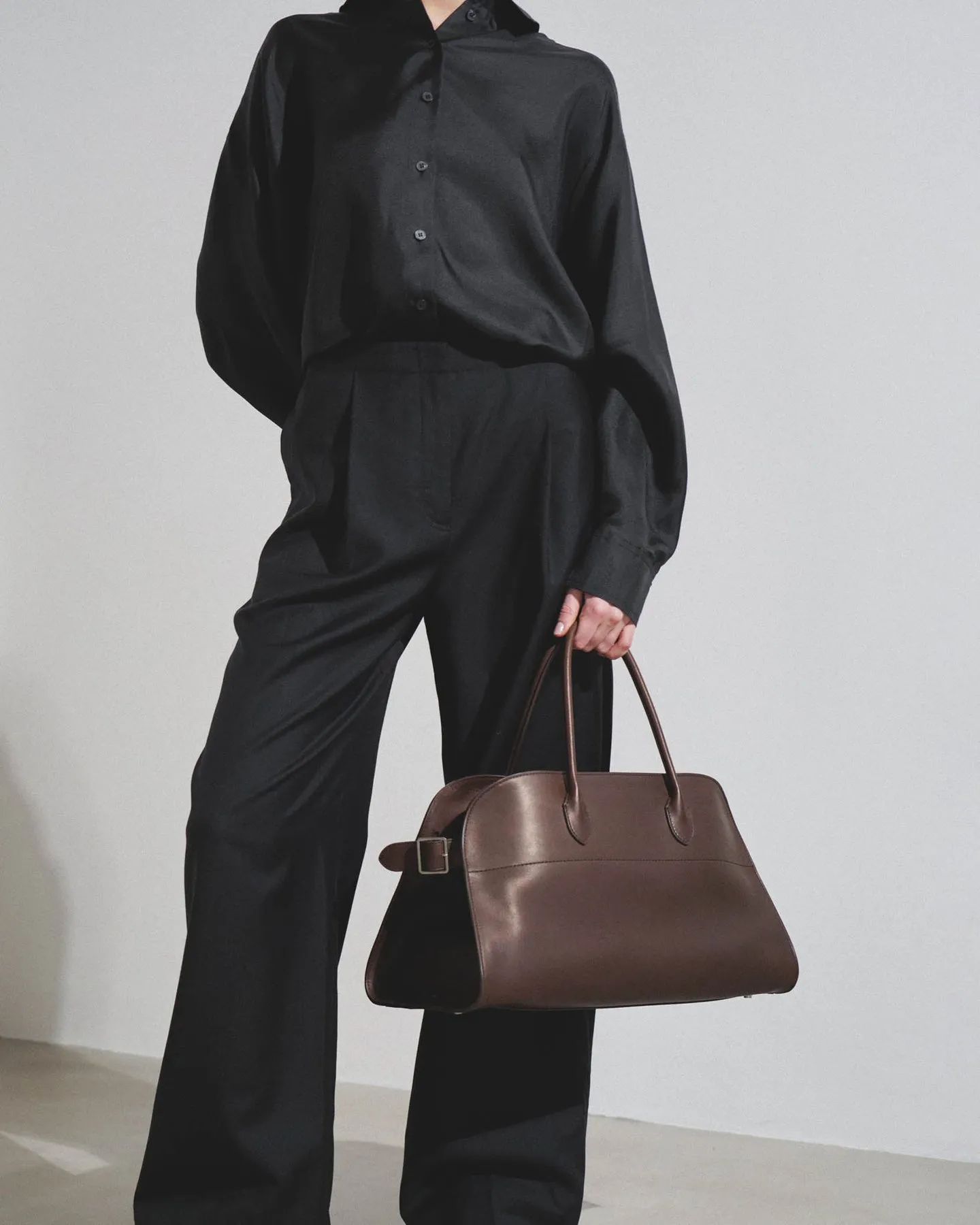 The Row EW Margaux dark brown leather bag