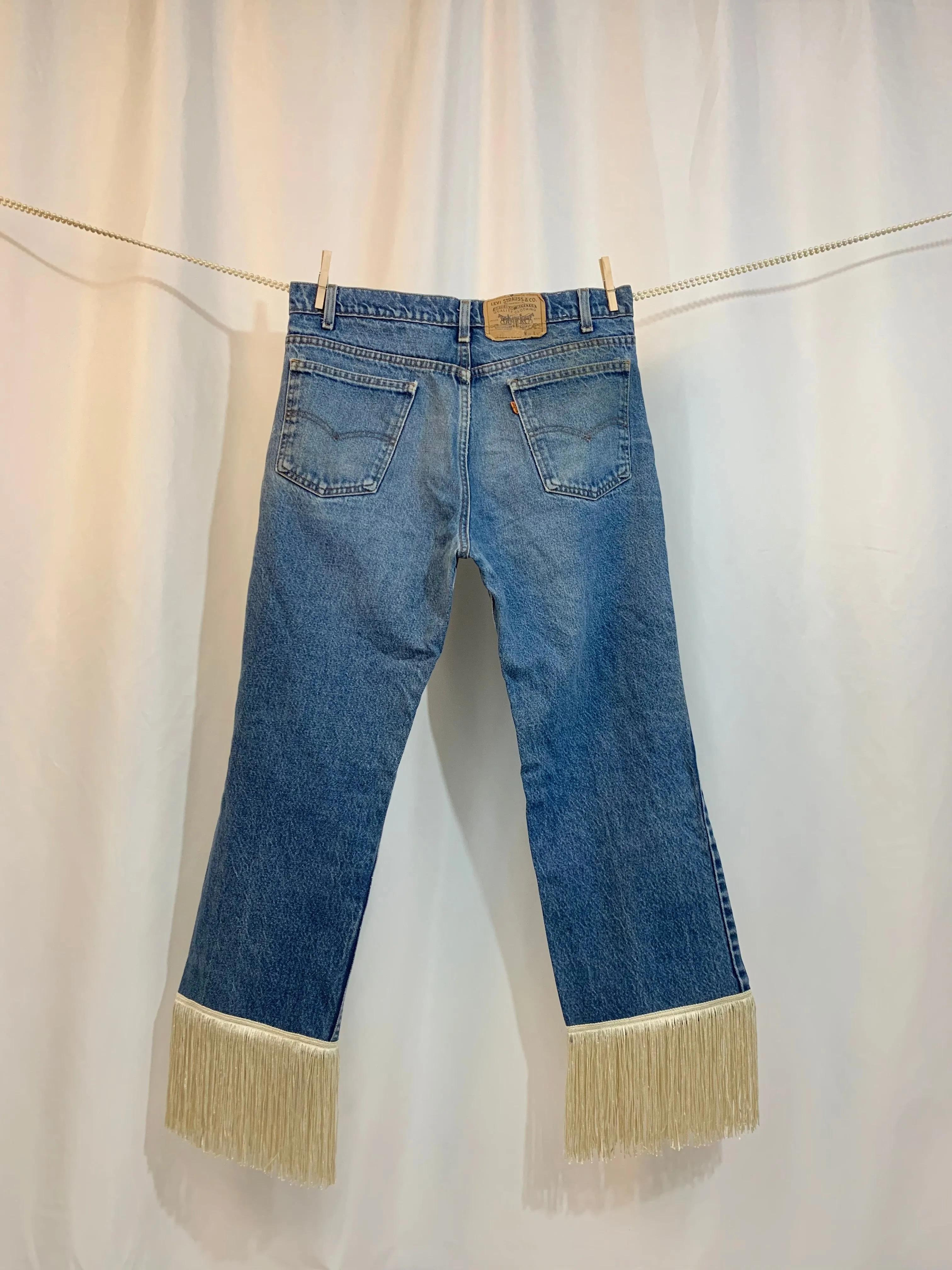 Upcycled 517 fringe jeans